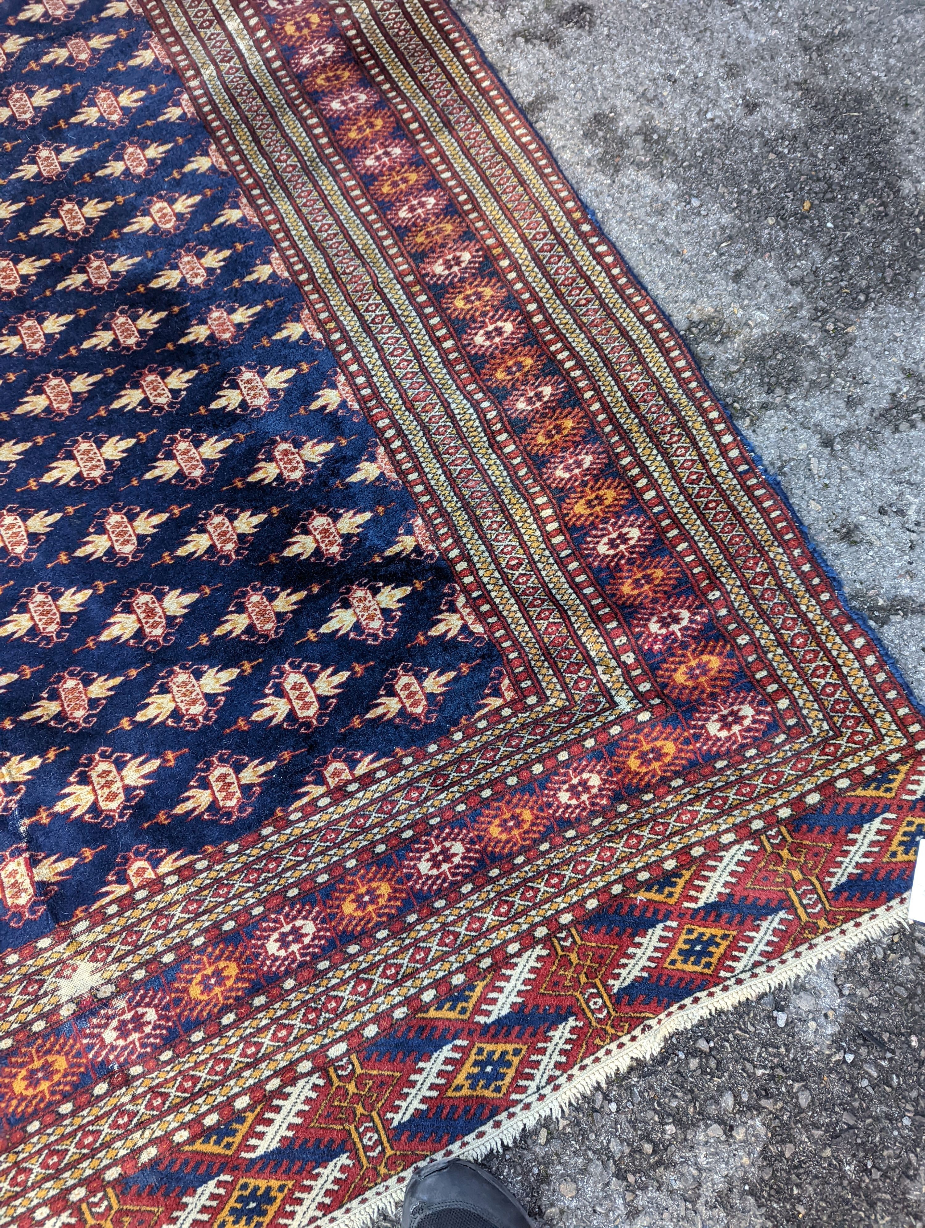 A Bokhara blue ground rug, 191 x 126cm